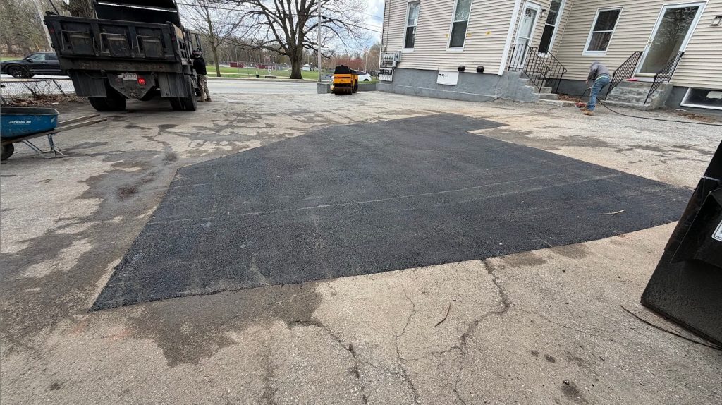 Lowell MA asphalt patch after repair at multifamily property